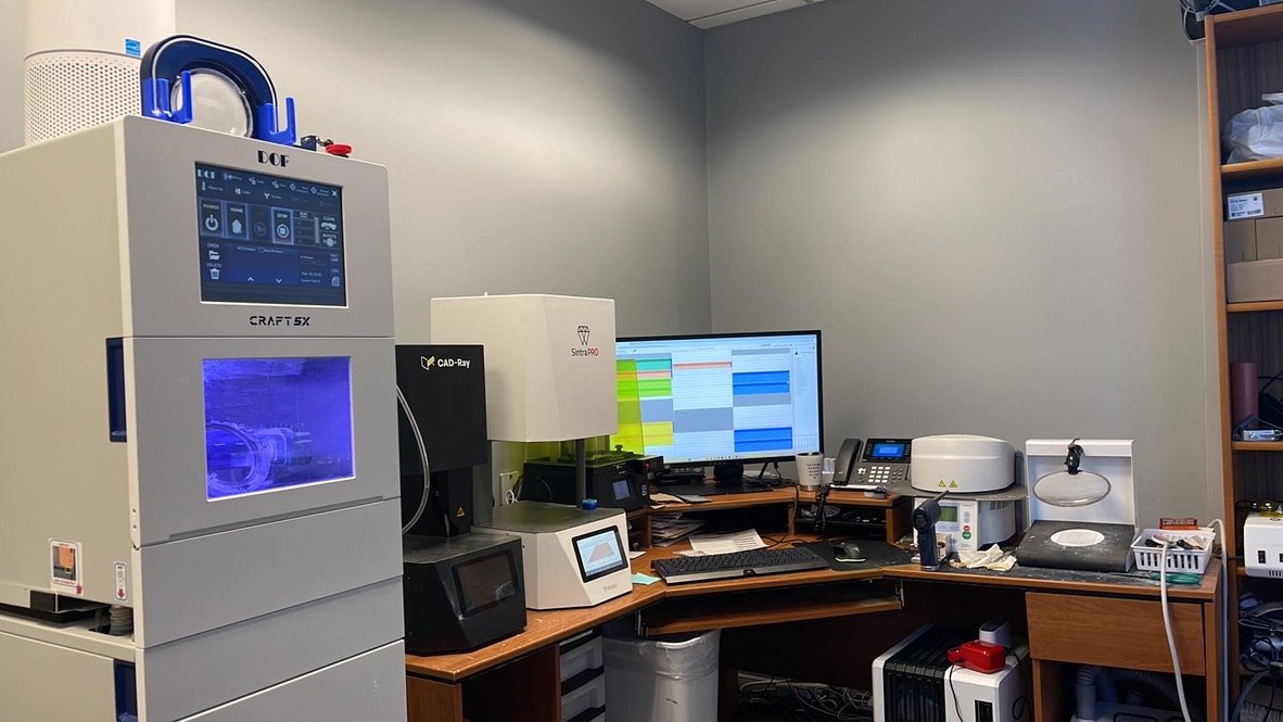 Our in-house CAD/CAM lab — DOF Craft 5-axis mill, SintraPRO furnace, CAD-Ray scanner, and Exocad design station